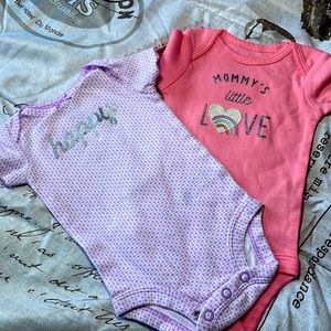 Two beautiful onesies pink and purple